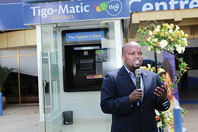 ICT minister Nsengimana speaking at the launch of Tigo-Matic. He lauded the innovation, saying it will boost efforts to promote a cashless economy. The New Times / Ben Gasore