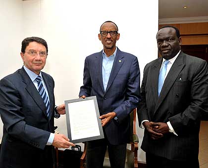 UNWTO boss Rifai hands over the open letter to President Kagame yesterday. Right is Ousmane Ndiaye, UNWTO director for Africa . The New Times/ Village Urugwiro.