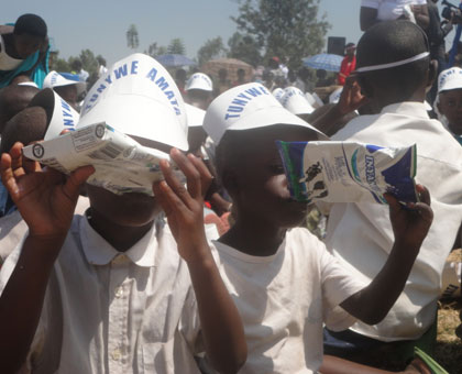 Children enjoy milk during the launch of the milk consumption campaign on Tuesday. Milk is known to be rich in proteins, calcium and vitamins. The New Times/JP Bucyensenge