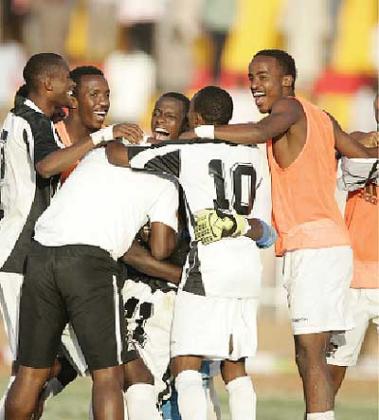 Goalkeeper Jean-Claude Ndoli is mobbed by APR players after his saves  sent the team into the final at Al Fasher Stadium. Saturday Sport / B. Mugabe