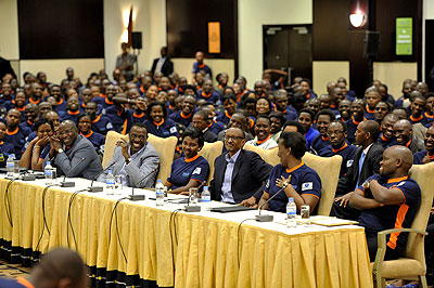 President Kagame, First Lady Jeannette and other officials share a light moment at the Youth Conneckt dialogue.