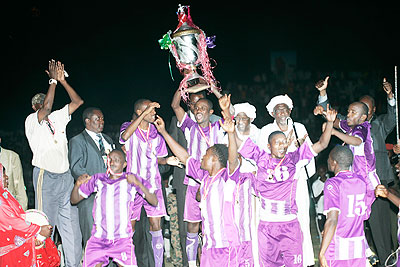 HISTORY: Vitalu2019O skipper and top goal scorer Amissi Tambwe lifts the Cecafa Kagame Cup Championship trophy last night at Al Fasher stadium. The New Times / B. Mugabe.