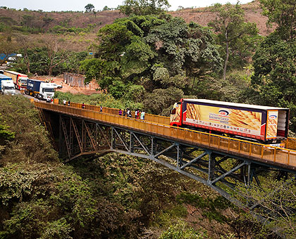 Trucks in transit cross a bridge in Rusumo. Amb. Kayonga has said the single customs treaty will not affect traders. The New Times/ Timothy Kisambira.