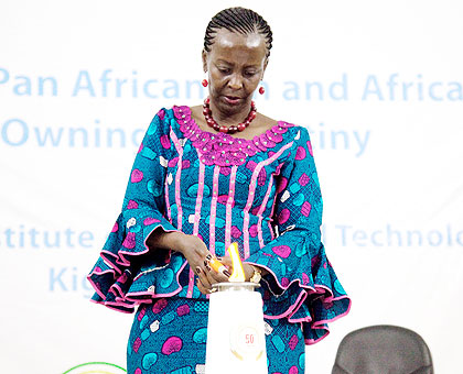 Minister for Foreign Affairs Louise Mushikiwabo lights the African Renaissance Torch in line with marking the Golden Jubilee of the African Union, and also a sign of Rwandau2019s commitment to the African dream. The New Times/Timothy Kisambira.