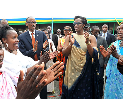 President Kagame and First Lady Jeannette join other patriotic Rwandans in songs and dance during celebrations to mark the 19th Liberation Day at Kami Barracks in Gasabo District yesterday. Kagame urged Rwandans to get involved in programmes that improve their wellbeing.    The New Times/ Village Urugwiro.