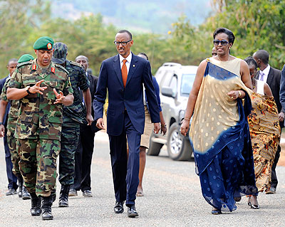 President Kagame and First Lady Jeannette Kagame arrive at Kami Barracks, Kinyinya Sector in Gasabo District to celebrate  the19th Liberation Day yesterday. Accompanying President Kagame is Chief of Defence Staff, Gen. Patrick Nyamvumba (L)  and other government officials.