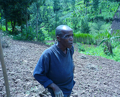 Ludovic Sibomana, a farmer in Kinyababa Sector, in his garden. RISD is seeking to curb land disputes. The New Times/ Timothy Kisambira.