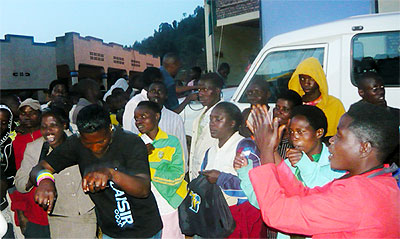 Residents of Nyarutarama Cell, Gicumbi Sector, watch HIV/Aids film during an evening of the Mobile Van Unit show by SFH. Courtesy.