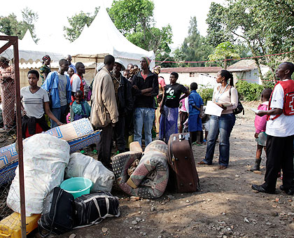 Conglese refugees at Goma-Rubavu border wait to board a Red Cross vehicle. The New Times/ Timothy Kisambira.