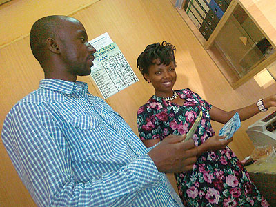 Customers wait to be served at a forex bureau in Kigali. Dealers are complaining that they are being u2018squeezedu2019 out of business by commercial banks. The New Times / Peterson Tumwebaze