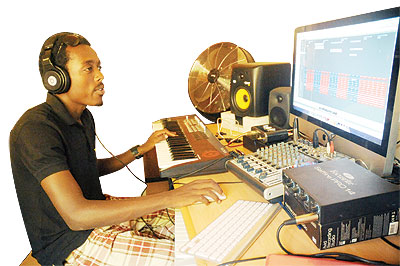 Sam Ryan in his studio, Beats Records. The New Times / John Mbanda.