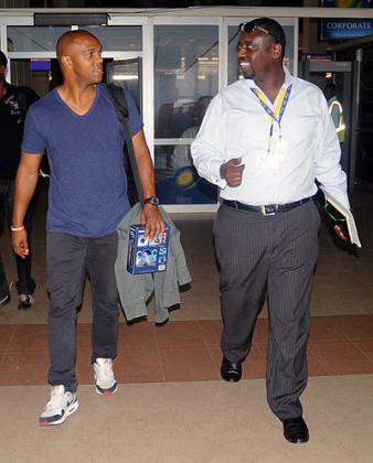 Manchester United legend Quinton Fortune [R] with William Mwiseneza, DHLu2019s Rwanda Customer Service Supervisor on arrival at Kigali International Airport.   The New Times /J. Mbanda. 