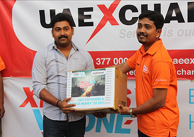 Suveesh Kottemal receiving playing T-shirts from UAE EXCHANGE Rwanda boss N. Riyaz at the inaugural ceremony.