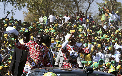 Zimbabweu2019s President Robert Mugabe and First Lady Grace Mugabe wave to supporters at a campaign rally in Chinhoyi, 115 km northwest of Harare, Zimbabwe, July 18, 2013. Mugabe on Thur....