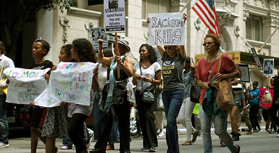 Protesters march during a demonstration against the verdict in the George Zimmerman trial, in Los Angeles. Net photo.