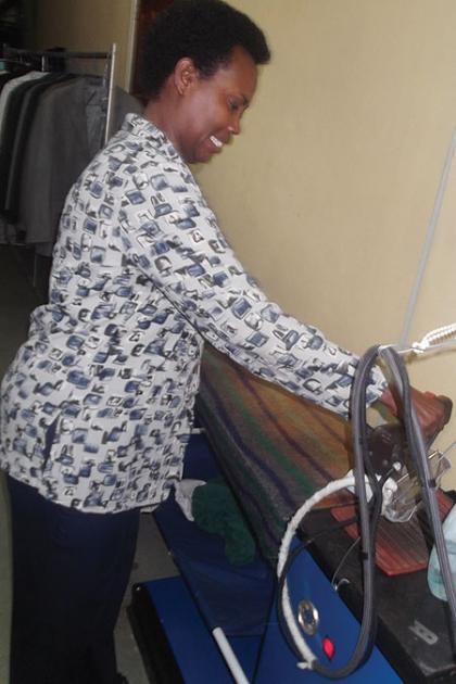 Uwimbabazi in one of her laundry enterprises. Her fighting spirit has seen her build a business empire from a small canteen. The New Times / Peterson Tumwebaze