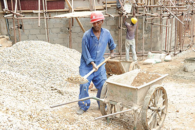 Workers at a building site. Checking the quality of materials promotes safety. The New Times / File 