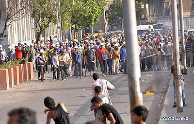 Supporters of Egyptu2019s ousted president Mohamed Morsi walk towards the opponents during clashes in Cairo, Egypt, July 22, 2013. The death toll of clashes between supporters and oppone....