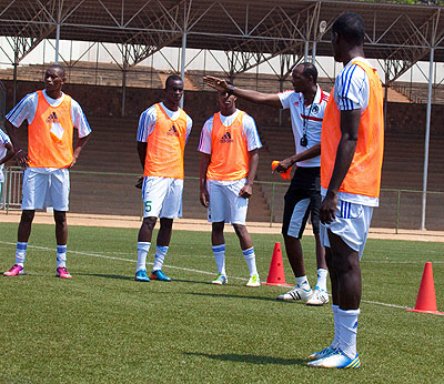 Eric Nshimiyimana (right) giving instructions to his players during yesterdayu2019s training session at Stade de Kigali. Mugiraneza (left) will lead Amavubi against Ethiopia today. Satur....