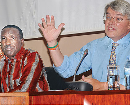 Senate President Jean Damascene Ntawukuliryayo (L) and UK Conservativeu2019s Andrew Mitchell at Parliament yesterday. The New Times/ J. Mbanda.