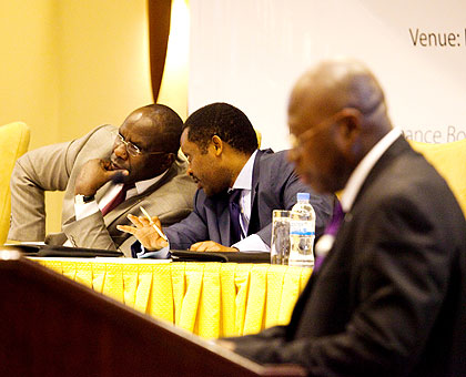 Manneh (R) gives his remarks as Shyaka (L) consults with Prime Minister Pierre Damien Habumuremyi.    The New Times/ Timothy Kisambira.