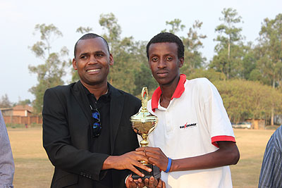 Kagarama's SS's Bryson Bugingo recieving his Man of the Tournament award from RNOC vice president Elie Mani. Times Sport / Courtesy