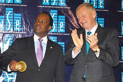 Umeme board chairman Patrick Bitature (left) and Chapman during the listing of the companyu2019s share at the NSE last year. Net photo