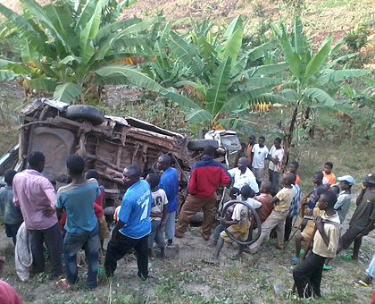 Shocked residents at the scene of the accident yesterday morning   The New Times/ Jean Pierre Bucyensenge