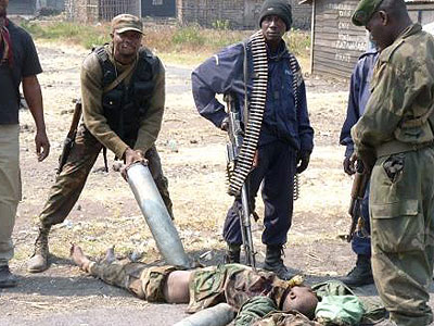 FARDC soldiers mutilating dead bodies of the u2018enemy fightersu2019. Net photo.