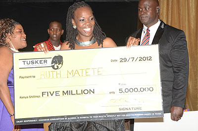 Last seasonu2019s winner Ruth Matete poses with the Ksh5M from the sponsors East African Breweries. Net photo.