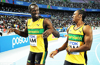Bolt will want to regain his world 100m title after losing out to compatriot Yohan Blake (right) in Daegu after false-starting. Net photo.