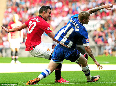 Van Persie shoots past James McClean's challenge and doubles United's advantage. Net photo.