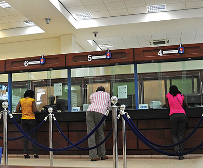 Bank customers being served. CRB has greatly helped banks detect would-be defaulters. The New Times / File
