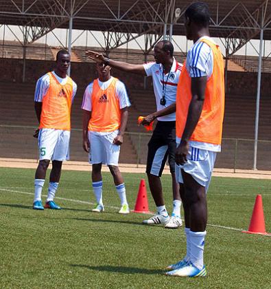 Coach Eric Nshimiyimana giving final rehearsal tips to amavubi defenders. Amavubi take on Malawi in an international friendly match this afternoon at Stade de Kigali. The New Times / T....