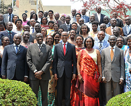 President Kagame (C) poses with the legislators in a group photo after dissolving Parliament yesterday. The New Times/Village Urugwiro.
