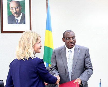 Hu00e5kansson and the Minister for Finance and Planning (R) after the signing. The New Times/Courtesy.