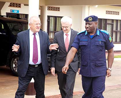 Ambassador Fahrenholtz (L), Stock and Gasana chat as they head for a meeting at the Police headquarters in Kacyiru yesterday. The New Times/ Timothy Kisambira.