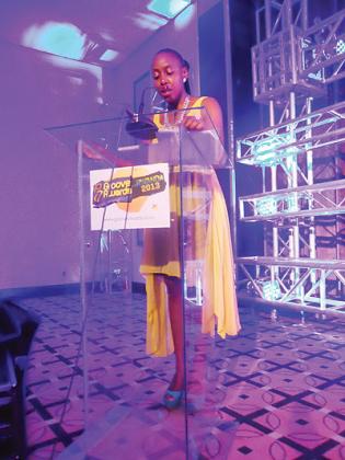 The manager of Groove Awards, Joy Wachira speaking during the event. The New Times / Susan Babijja.
