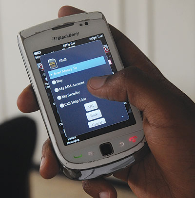 Banks have looked to the mobile phone to strenghten their competitiveness . The New Times / John Mbanda