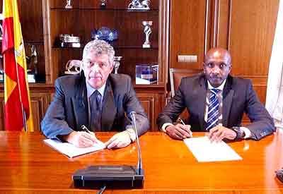 Ferwafa chairman Ntagungira (R) and his Spanish counterpart Llona sign the cooperation pact yesterday. Times Sport/ Courtesy.