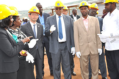 Prof. Lwakabamba (C), Amb. Ogawa (3rd L) and other officials at Musha electricity sub-station. The New Times S. Rwembeho.   The New Times/ Stephen Rwemb eho.