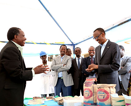 President Kagame discusses the benefits of storage facilities with Joseph Gafaranga, one of the farmers from across the country whose harvest have grown from a few hundred kilogrammes ....