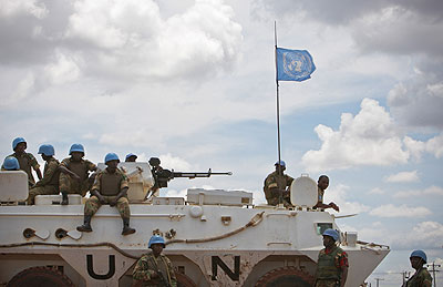Soldiers serving with the UNIMIS sitting on a tank at Abyei town.Xinhua photo.