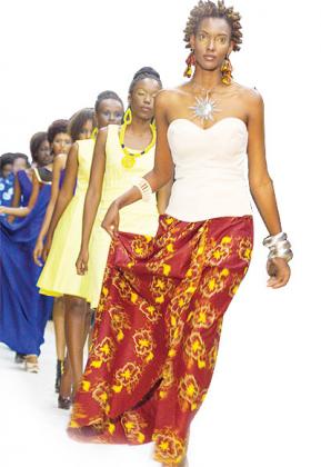 Alexia Uwera Mupende hits the stage with a cross section of models at the Rwanda Fashion Upgrade.