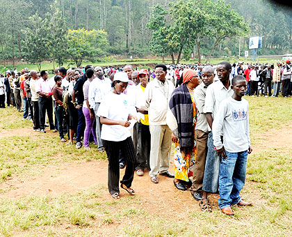 Voters wait to cast their ballot during a past election exercise. Women candidates say they have no money to canvass rallies.  The New Times/ File.