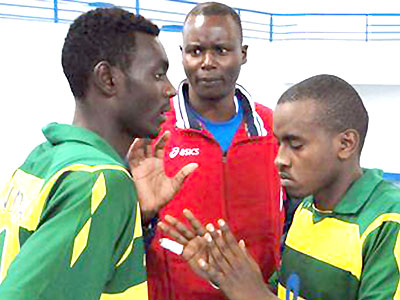 Rwanda junior volleyball national head coach Paul Bitok (C) giving instructions to his players. Times Sport/Courtesy
