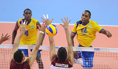 Rwanda's Aimable Mutuyimana (right) spikes against Venezuela's block on Thursday. Times Sport / Courtesy.