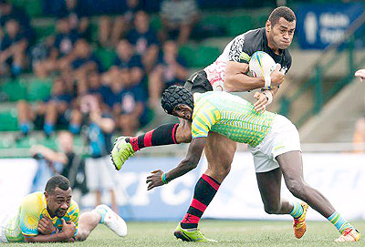 Silverbacks 7s Captain Lucien Bikamba (right) goes in for a hard tackle during the 2011 Hong Kong 10s tournament. Times Sport/ Courtesy.