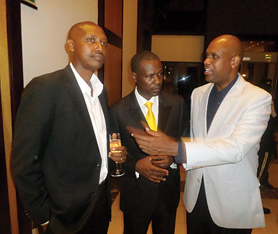 RwanAir CEO John Mirenge chats with other guests at the cocktail party. The New Times / Ivan Ngoboka