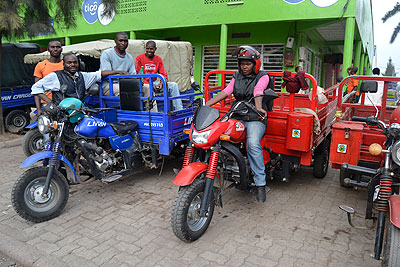 Uwanyuze waits for clients with her male colleagues in Musanze town.   The New Times/ By Jean du2019Amour Mbonyinshuti